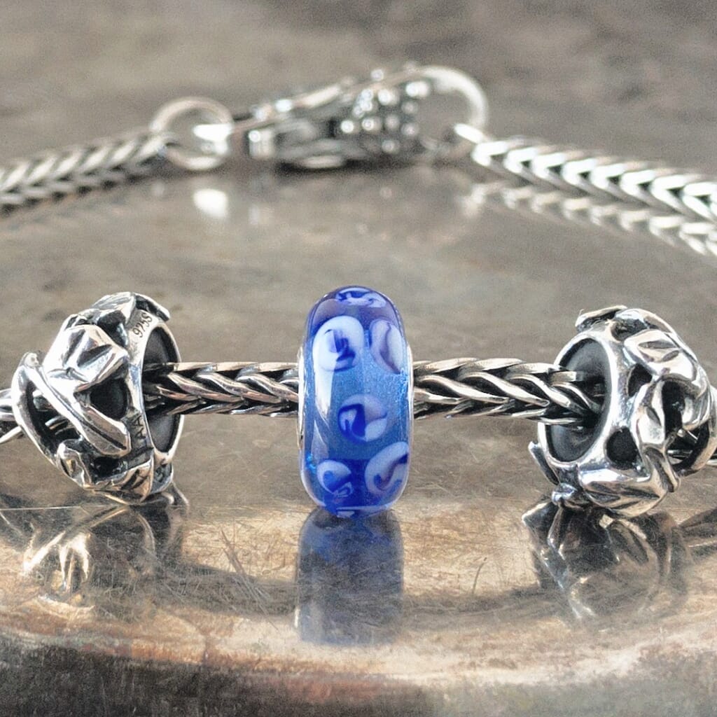 Suzie Q Studio has a treasure vault full of Rare & Retired Trollbeads... and we’re making them available to you. We’re starting with our Rare & Retired Glass Beads. Dots of multi-hues of blue, dance across the surface of this rare glass Trollbead… A true beauty for those of you who love blue! 