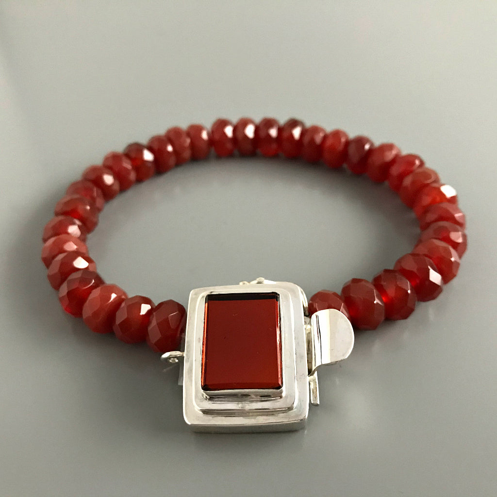The rich, “Rootbeer” brown color of the cabochon in this Suzie Q Studio box clasp has a mirror finish at the base of it, which makes it very versatile to create a casual, organic piece or something more “upscale”. It looks wonderful with the faceted, dark carnelian stone beads shown in one of the images here.