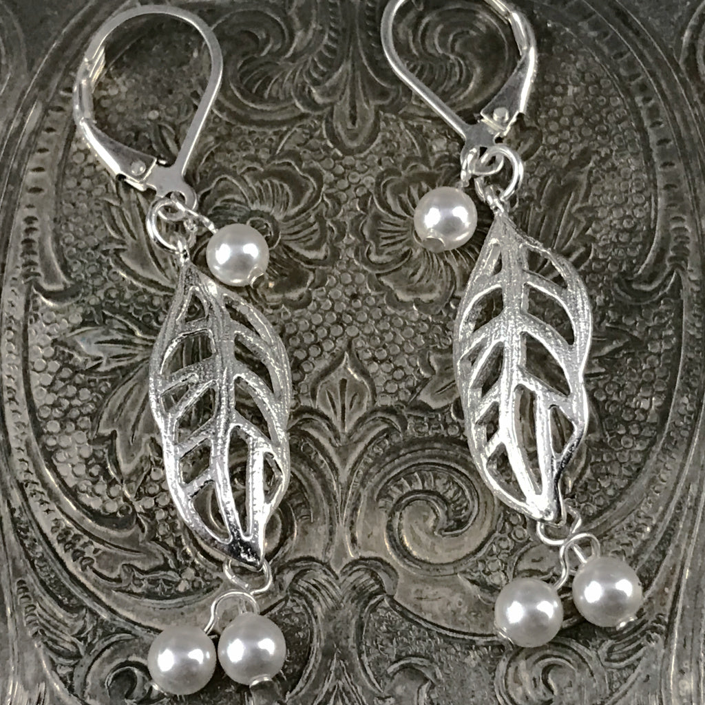 This Suzie Q Studio earring collection features handmade earrings created by Suzie Q Studio artisans. Light and airy, these sterling silver, handcrafted, one-of-a-kind “lacy leaf” style earrings are a delight to wear and available in a variety of colors, but only ONE pair of each design, so don’t miss out on the pair that suits your own inimitable style!