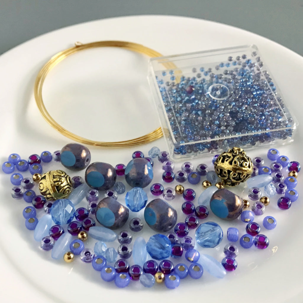 The periwinkle blue and purple-ish hues in Suzie Q Studio's Blueberry Tart DIY jewelry-making kit totally have the vibe of “Pantone’s" Color of the Year for 2022: “Very Peri”… Don’t you think?!