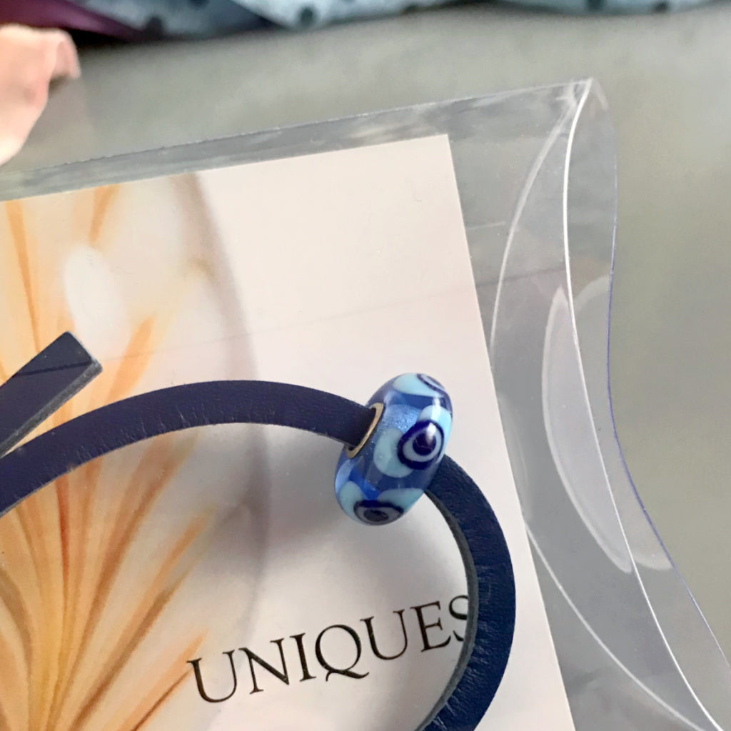 Trollbeads UNIQUES are individually handmade, one-of-a-kind glass beads. This fab Suzie Q Studio UNIQUES glass bead showcases a variety of blue tones - perfect to wear with denim.
