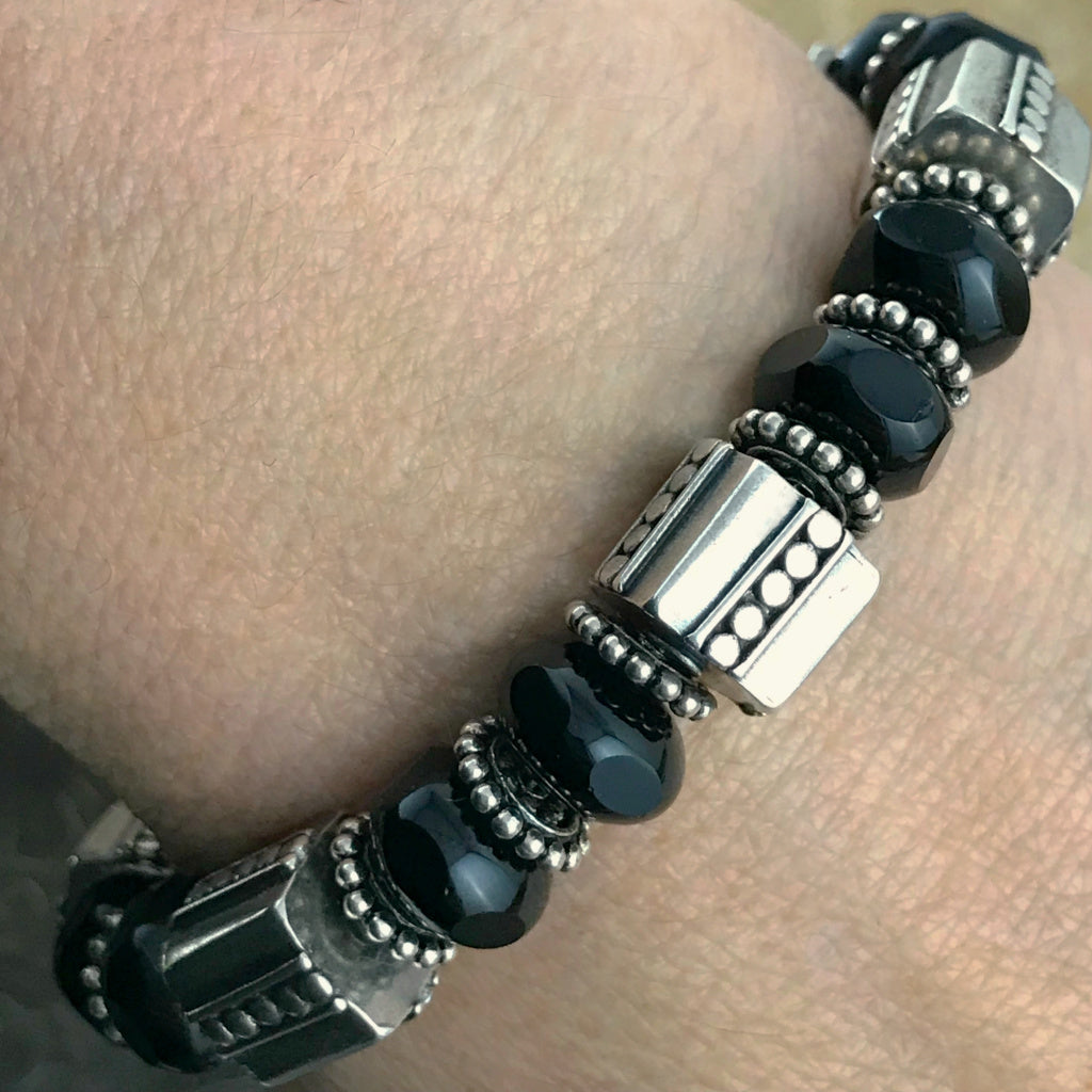 The exquisite sterling beads in this Suzie Q Studio bracelet are combined with a secure, vintage glass, sterling silver box-style clasp and black Czech pressed-glass beads to give this bracelet a timeless, classic look.