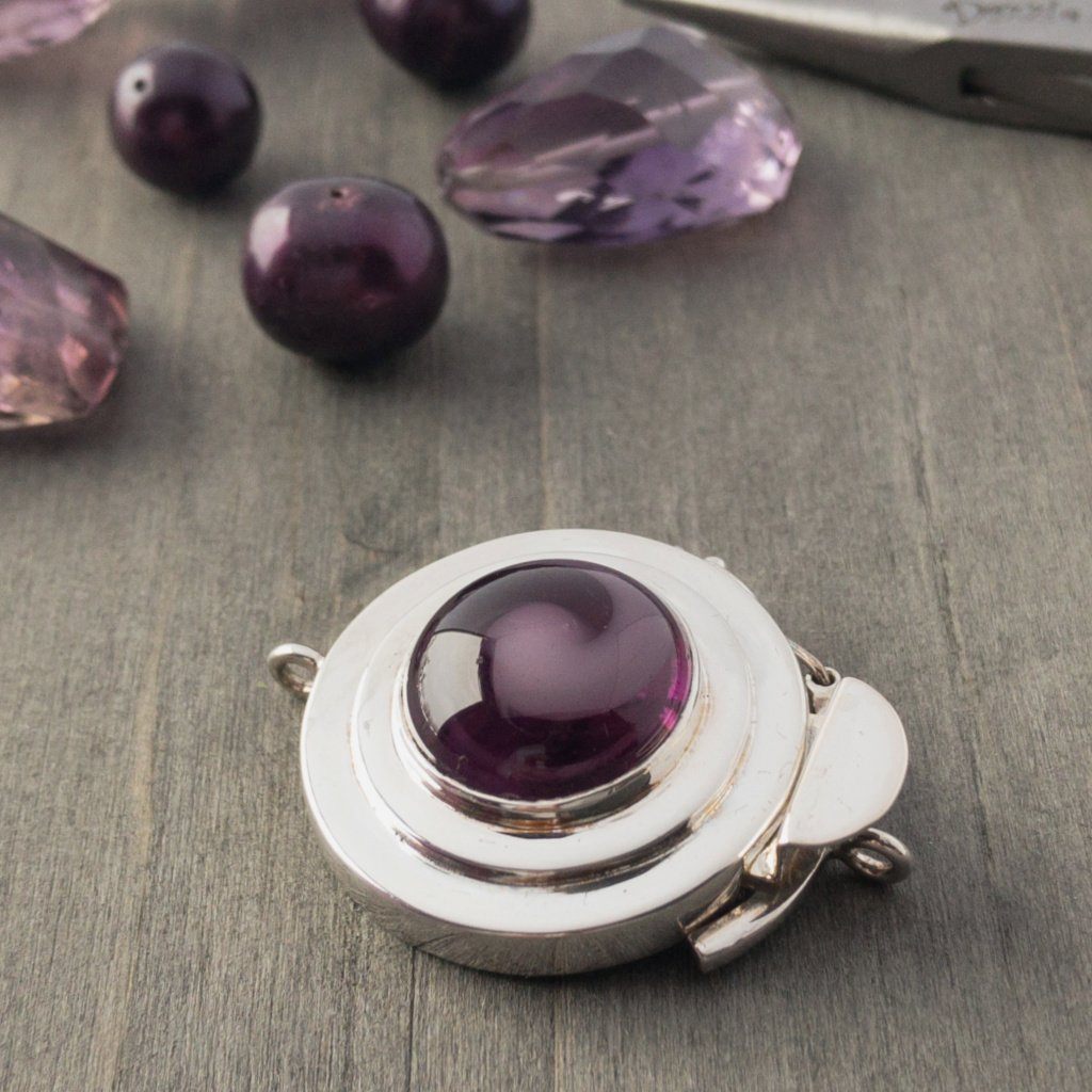 If you love the colour purple, this regal clasp has your name all over it. With a swirl of delicate lilac, over a base of rich amethyst, this vintage glass cabochon will inspire you to create a beautiful piece of jewellery, suitable for the Queen that you are!