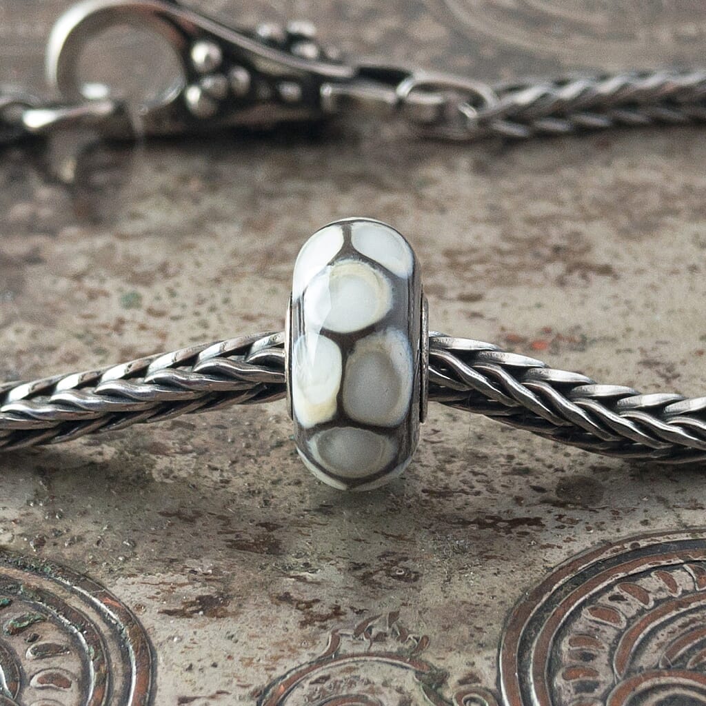The rare and retired Trollbeads Collection at Suzie Q Studio includes this fabulous Silver Python glass bead.