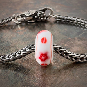 Suzie Q Studio’s Trollbeads UME – Red Plum Blossom on White – glass bead in the KIMONO Collection that was created in the delicate matte colours of a Japanese kimono.
