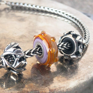 Suzie Q Studio has a treasure vault full of Rare & Retired Trollbeads... and we’re making them available to you. We’re starting with our Rare & Retired Glass Beads. We’ll be adding lots more so check back often. The plisè and colors of the IZZEY Trollbead are inspired by the Issey Miyake collection.