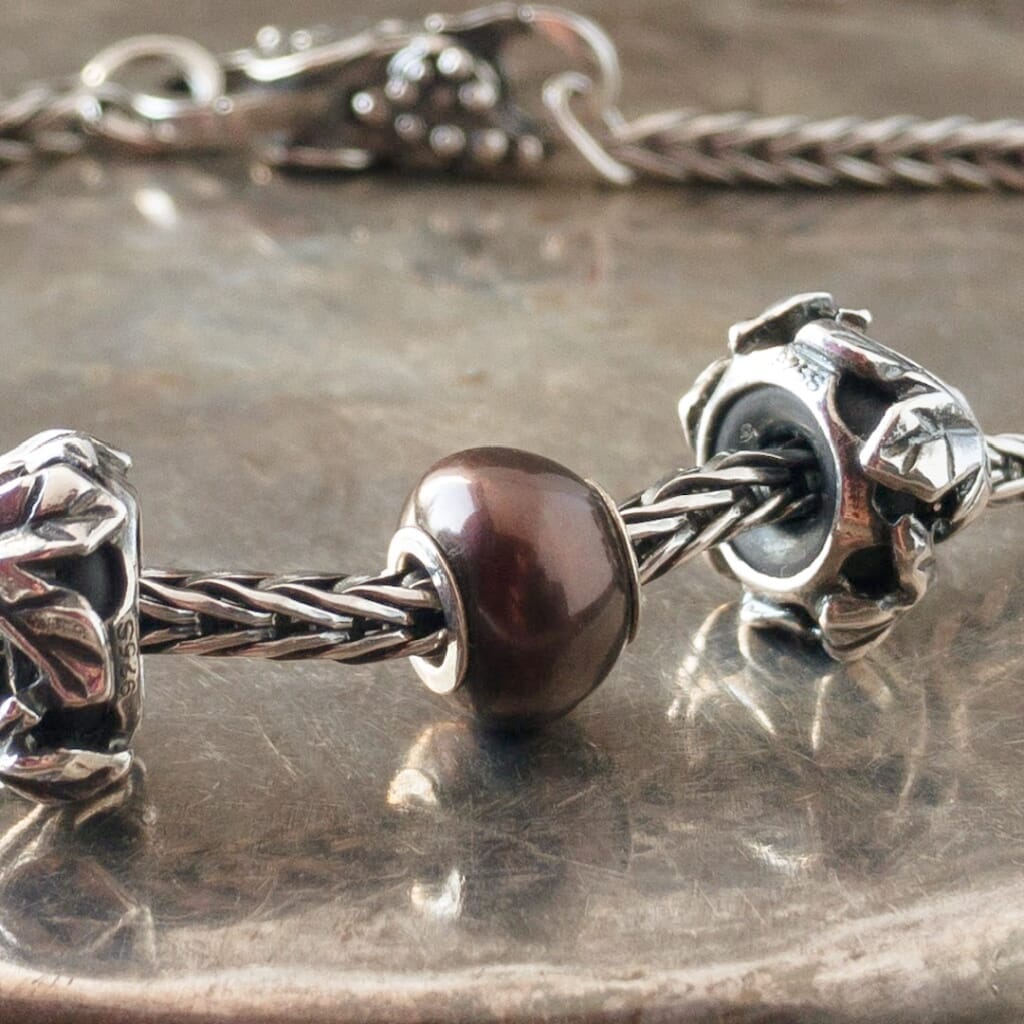 The three Black Pearl Trollbeads currently available at Suzie Q Studio have a sterling silver core and are smaller, more organically shaped than Trollbeads pearls available in later years makes them extra-unique and oh-so-precious! Visit Suzie Q Studio for new stock, never worn, collectible Rare & Retired Trollbeads.