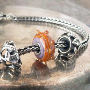 Suzie Q Studio has a treasure vault full of Rare & Retired Trollbeads... and we’re making them available to you. We’re starting with our Rare & Retired Glass Beads. We’ll be adding lots more so check back often. The plisè and colors of the ISSEY Trollbead are inspired by the Issey Miyake collection.