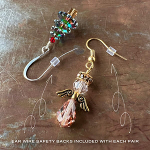 Silicone ear wire safety backs shown on Swarovski crystal, Christmas tree and angel earrings, and are included with each pair of holiday earrings.