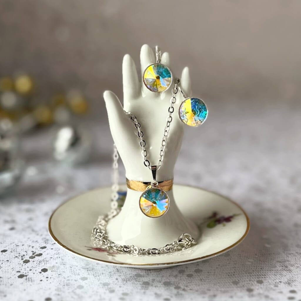 Swarovski crystal, "rivoli" stone style earrings, with AB/Aurora Borealis effect and secure, silver pated, lever-back ear wires.