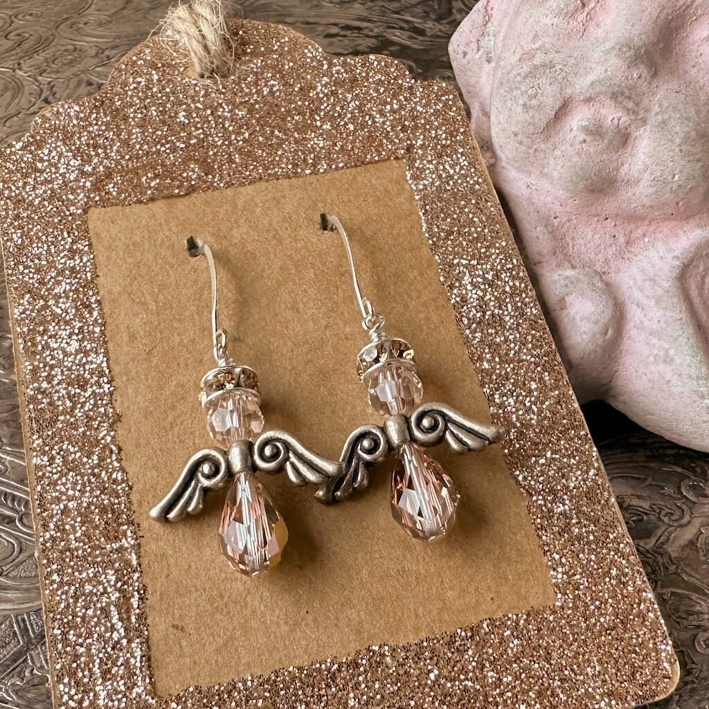 Swarovski crystal Christmas angel earrings at Suzie Q Studio, in various neutral colours, sparkly halo, silver wings and silver plate ear wires.