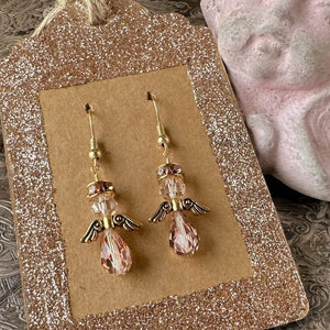 Swarovski crystal Christmas angel earrings at Suzie Q Studio, in various neutral colours, sparkly halo, gold wings and gold-tone ear wires.