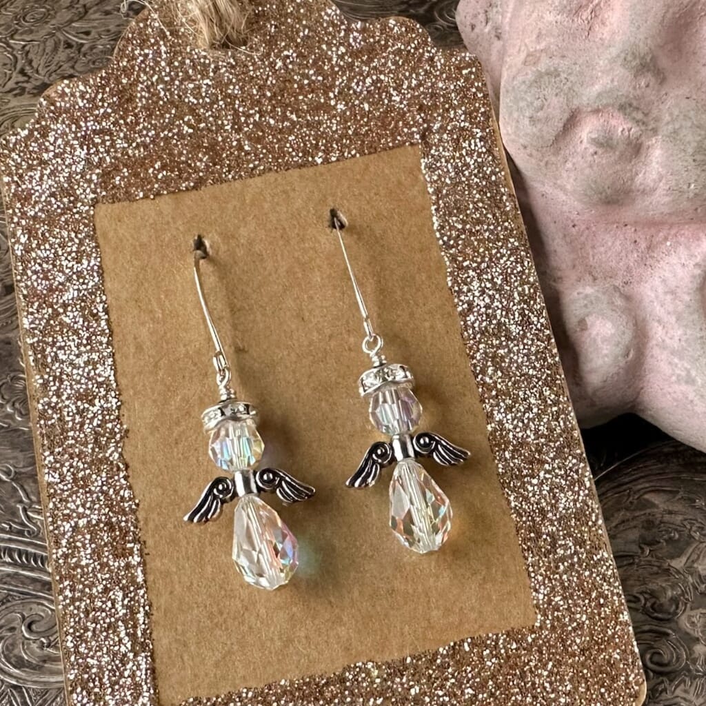 Swarovski crystal Christmas angel earrings at Suzie Q Studio, with crystal AB beads, sparkly halo, silver wings and silver plate ear wires.