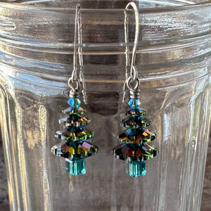 Swarovski crystal “Elvis Blue Christmas” tree earrings at Suzie Q Studio, in various tones of ocean blue, tree top to trunk, with silver plate ear wires.