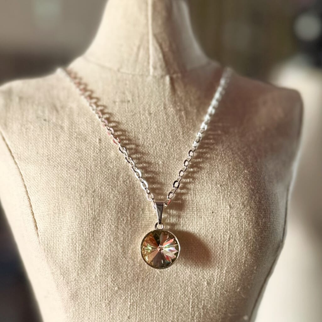 Swarovski crystal necklace, with round, "rivoli” stone pendant, with a crystal "Sahara"  green finish, on a delicate, silver-plated chain.