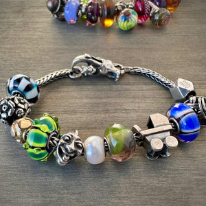 Trollbeads 30th Anniversary, limited edition beads, originally released in 2006, shown on a sterling silver bracelet, and available at Suzie Q Studio.
