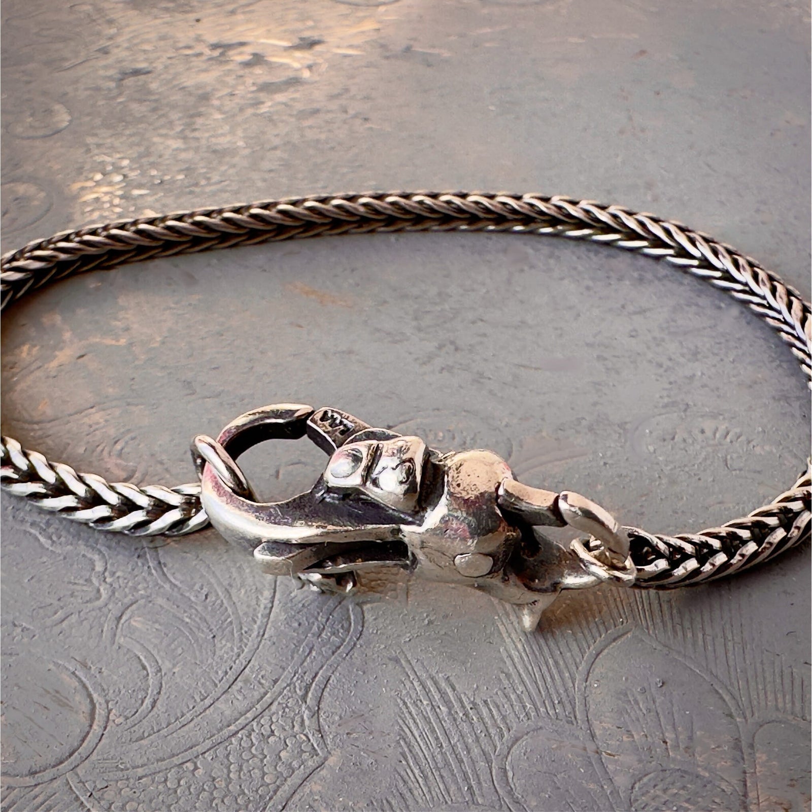 Trollbeads 30th Anniversary, sterling silver lock called, TROLL LOCK, originally released in 2006, shown on a sterling silver bracelet.