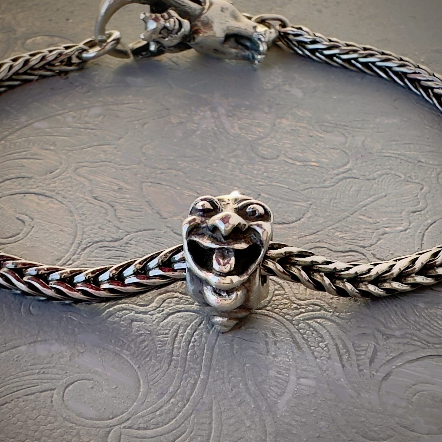 Trollbeads 30th Anniversary, sterling silver bead called, TWO TROLLS, originally released in 2006, shown on a sterling silver bracelet, with lock. Shop online for one-of-a-kind treasures at Suzie Q Studio.