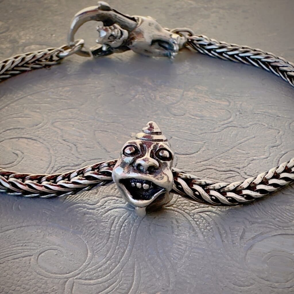 Trollbeads 30th Anniversary, sterling silver bead called, TWO TROLLS, originally released in 2006, shown on a sterling silver bracelet, with lock. Shop online for one-of-a-kind treasures at Suzie Q Studio.