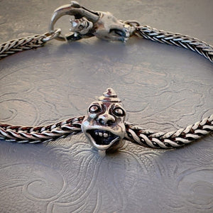 Trollbeads 30th Anniversary, sterling silver bead called, TWO TROLLS, originally released in 2006, shown on a sterling silver bracelet, with lock.