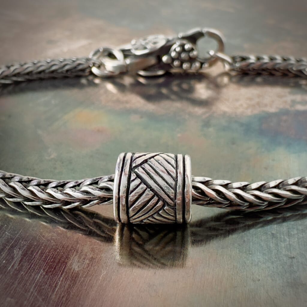 Suzie Q Studio’s Trollbeads DRUM BEAT - WORLD TOUR, SOUTH AFRICA sterling silver bead was created for World Tour, South Africa to celebrate the people and cultures of Africa. Shop online for one-of-a-kind treasures at Suzie Q Studio.