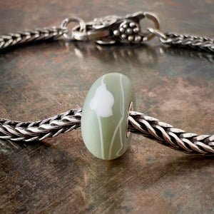 Suzie Q Studio’s Trollbeads Kimono "Tsuru" Bead – White Bird on Khaki/Green/Grey – symbolizes good luck and long life, fidelity and peace. Shop online for one-of-a-kind treasures at Suzie Q Studio.