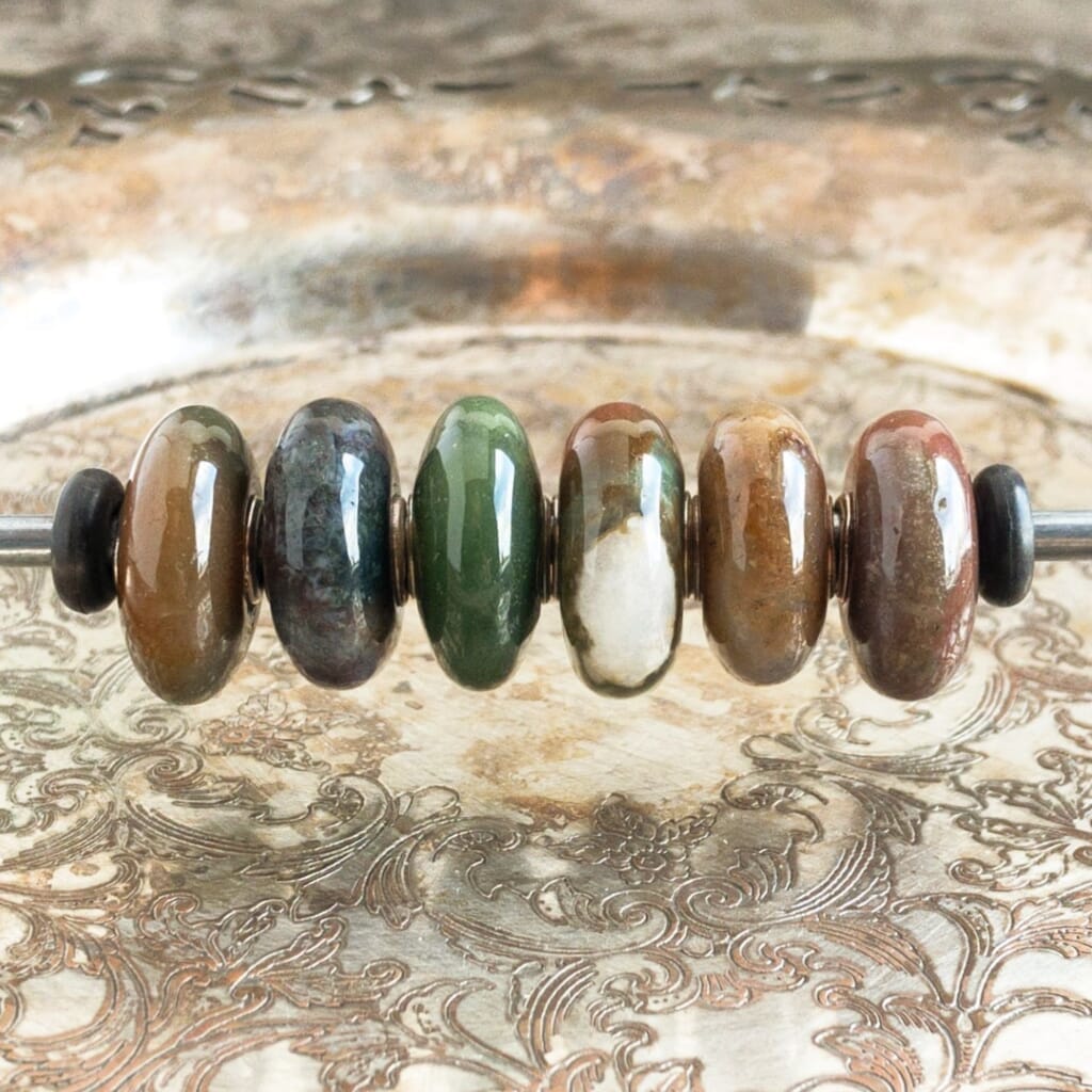 The Trollbeads FANTASY JASPER, SIX BEAD SET - ZEBRA JASPER was a Limited Edition release and Suzie Q Studio only has one set! The Jasper gemstone is believed to enhance ideas as well as creativity. Visit Suzie Q Studio for new stock, never worn, collectible Rare & Retired Trollbeads.