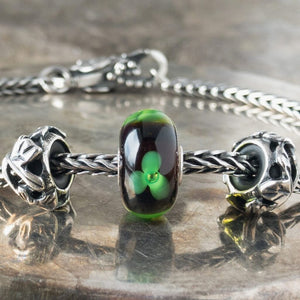 Suzie Q Studio has stashed away special glass, sterling silver and limited edition Trollbeads pieces in the Suzie Q Studio “Troll Treasures Vault”. This Trollbeads Retired Green Flower Glass Bead is a rare beauty. We’re adding lots more to our Trollbeads Rare and Retired Collection so check back often!