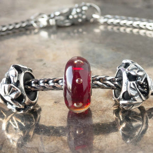Suzie Q Studio has stashed away special glass, sterling silver and limited edition Trollbeads pieces in the Suzie Q Studio “Troll Treasures Vault”. This Trollbeads Glass Bead Collection features some rare beauties, such as this luscious Red Bubbles bead.