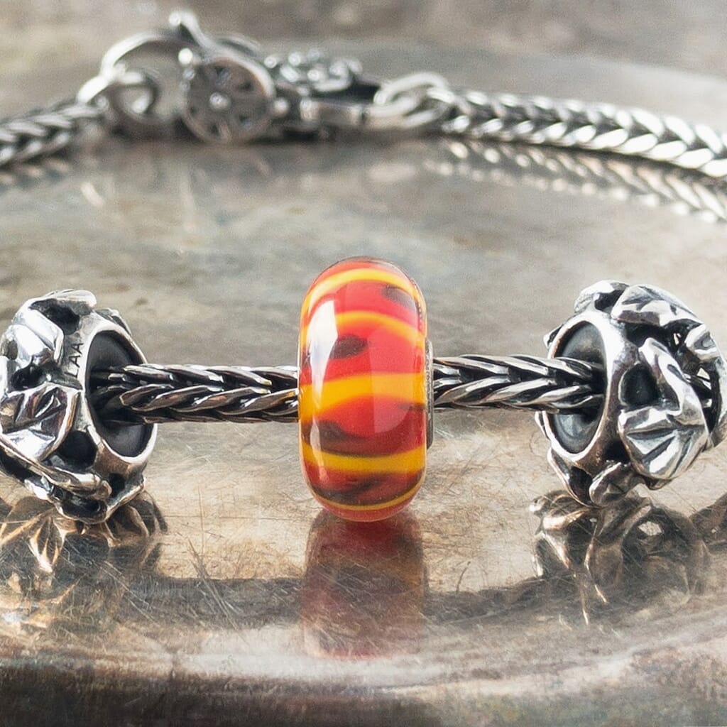 Suzie Q Studio has a treasure vault full of Rare & Retired Trollbeads... and we’re making them available to you. We’re starting with our Rare & Retired Glass Beads. Like an exotic fruit from the Garden of Eden, this RED SHADOW Trollbead looks sweet and juicy... it entices all your senses.