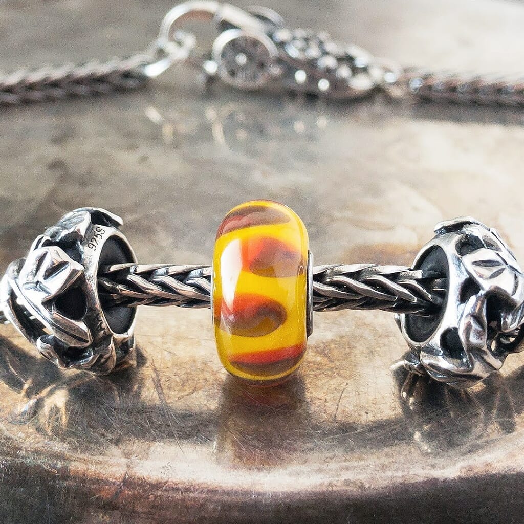 Suzie Q Studio has a treasure vault full of Rare & Retired Trollbeads... and we’re making them available to you. We’re starting with our Rare & Retired Glass Beads. Like an exotic fruit from the Garden of Eden, this RED SHADOW Trollbead looks sweet and juicy... it entices all your senses.