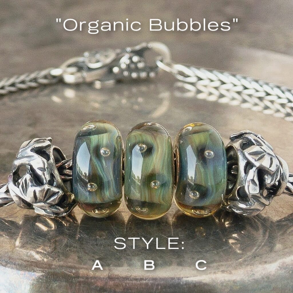 Three versions of glass ORGANIC BUBBLES Trollbead, with bubbles & organic, natural colours, on a Trollbeads silver bracelet.