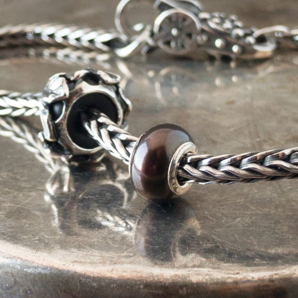 The three Black Pearl Trollbeads currently available at Suzie Q Studio have a sterling silver core and are smaller, more organically shaped than Trollbeads pearls available in later years makes them extra-unique and oh-so-precious! Visit Suzie Q Studio for new stock, never worn, collectible Rare & Retired Trollbeads.