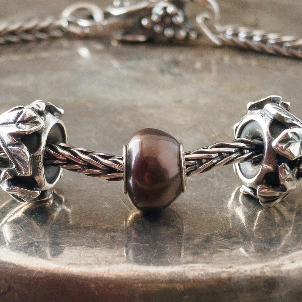 The three Black Pearl Trollbeads currently available at Suzie Q Studio have a sterling silver core and are smaller, more organically shaped than Trollbeads pearls available in later years makes them extra-unique and oh-so-precious! Visit Suzie Q Studio for new stock, never worn, collectible Rare & Retired Trollbeads.