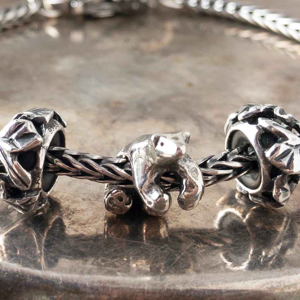 Trollbeads sterling silver ICE BEAR bead, depicting a polar bead, shown on a sterling silver Trollbeads bracelet.