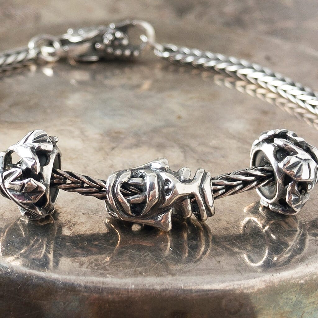Trollbeads FABLED FACES sterling silver bead, two different faces representing light & dark in life, on Trollbeads silver bracelet.