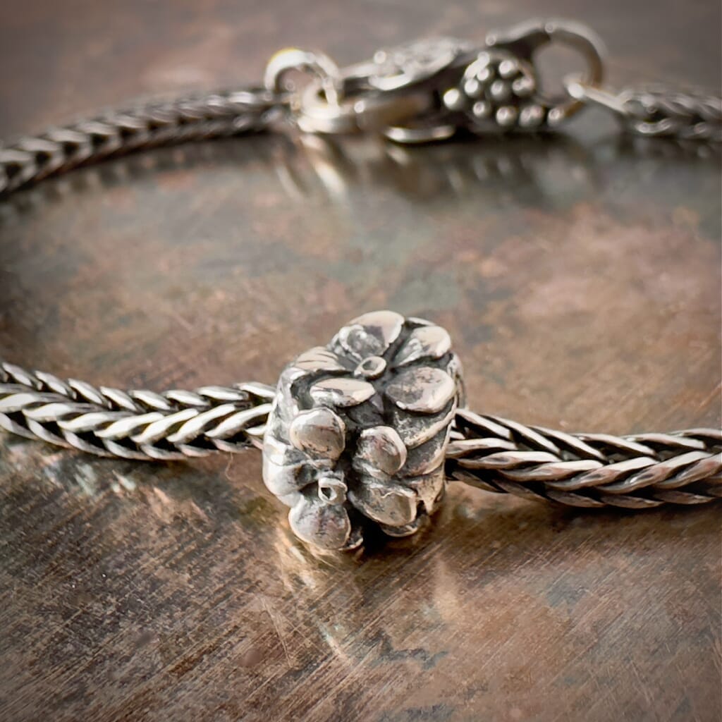 Suzie Q Studio's Trollbeads Rose bead: Embrace timeless beauty and love with this sterling silver rose design. Shop online for one-of-a-kind treasures at Suzie Q Studio.