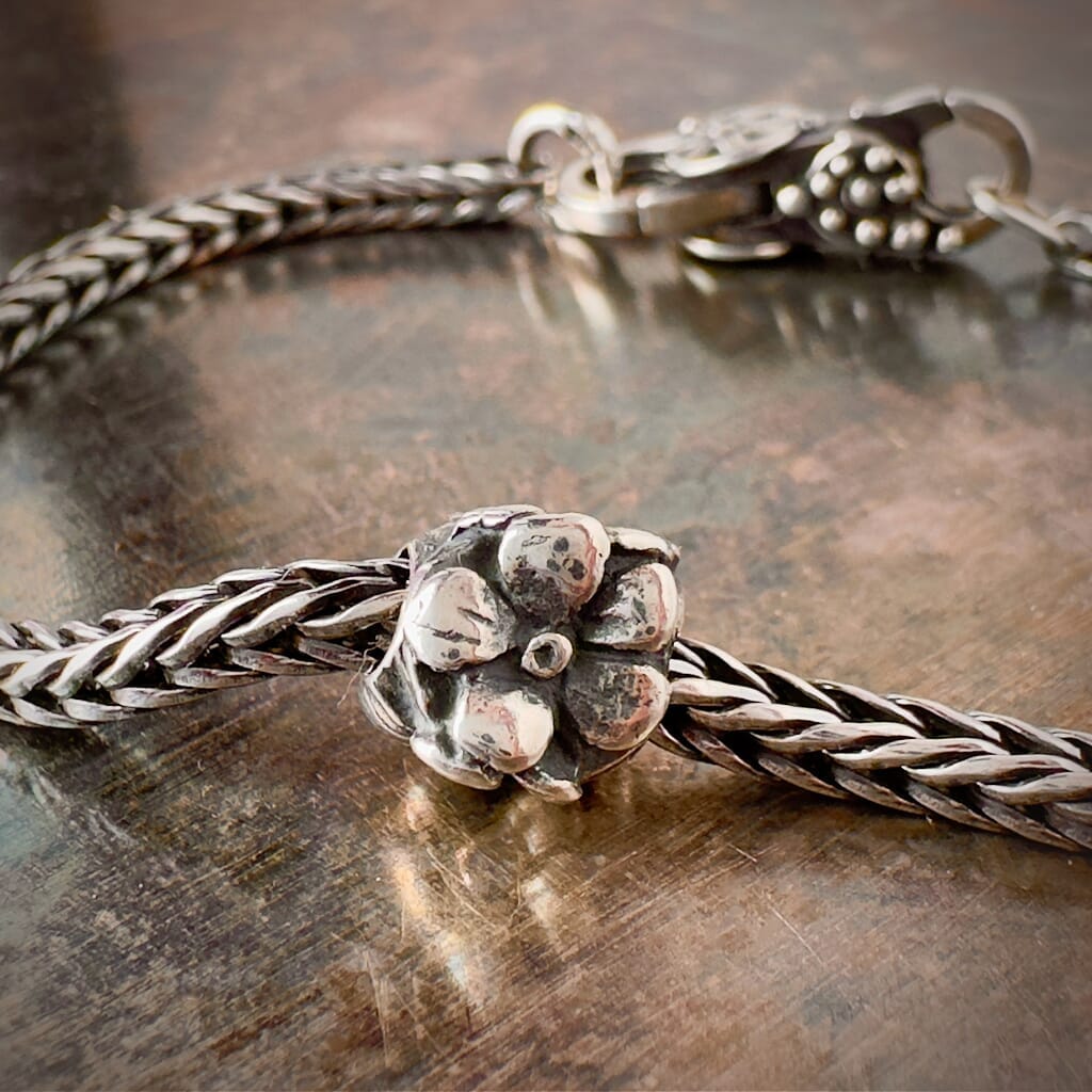 Suzie Q Studio's Trollbeads Rose bead: Embrace timeless beauty and love with this sterling silver rose design. Shop online for one-of-a-kind treasures at Suzie Q Studio.