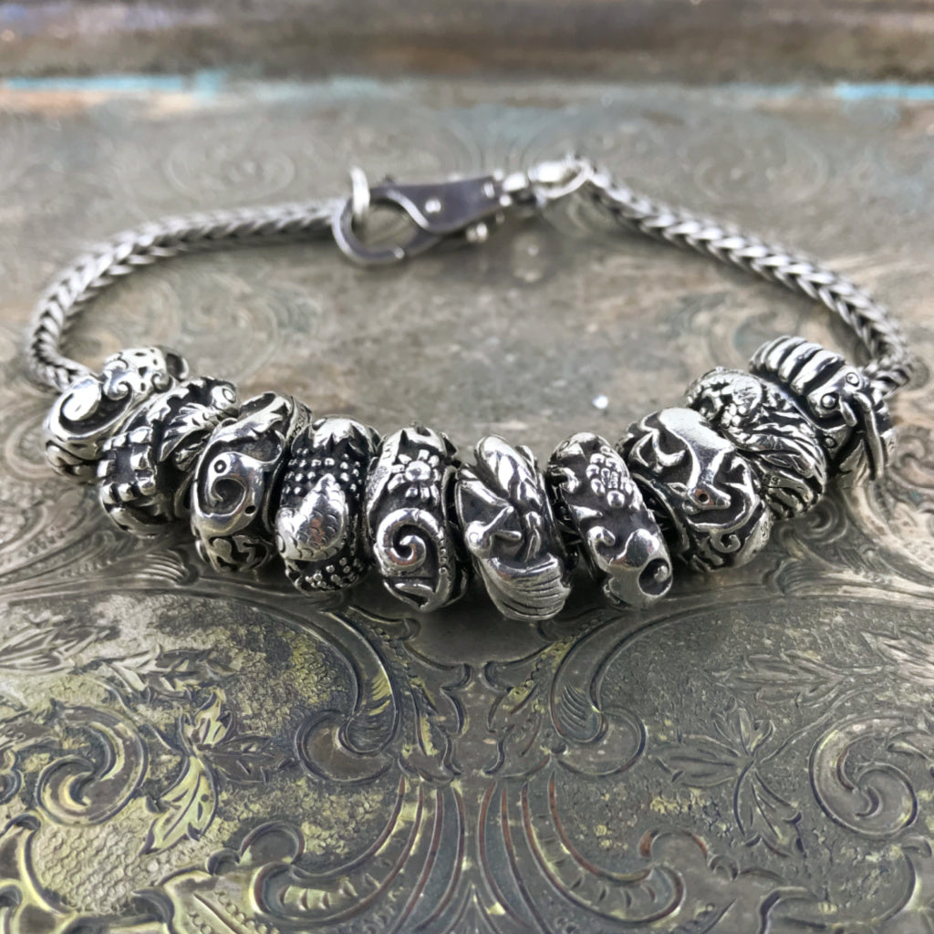 Now available at Suzie Q Studio, the complete set of 10  Trollbeads China Limited Edition Sterling Silver Beads. All NEW stock and never worn.