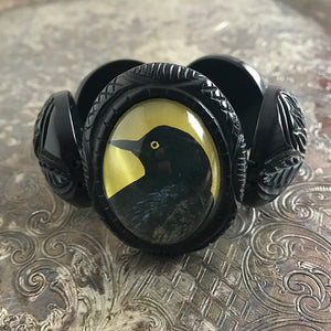 Suzie Q Studio carries HOTCAKES DESIGN retro-style, handmade jewelry taking its inspiration from classic Bakelite jewelry, vintage images and bold color.  This cameo-style focal piece featuring a Raven, surrounded by amazingly detailed, carved resin, faux “Bakelite” beads, makes this bracelet an absolute show-stopper.