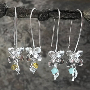 This Suzie Q Studio earring collection features handmade earrings created by Suzie Q Studio artisans. If you love a more delicate, modern-natural look, these precious, handcrafted sterling silver flower earrings, with a hint of Swarovski sparkle, are perfect for you and they're available in a variety of gorgeous colors.