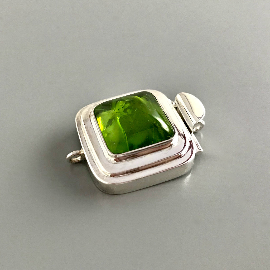 This Suzie Q Studio custom box clasp was handcrafted with a juicy, rich, lime-green vintage glass cabochon and set in a substantial amount (more than average) of sterling silver for a statement-making piece of jewelry. 