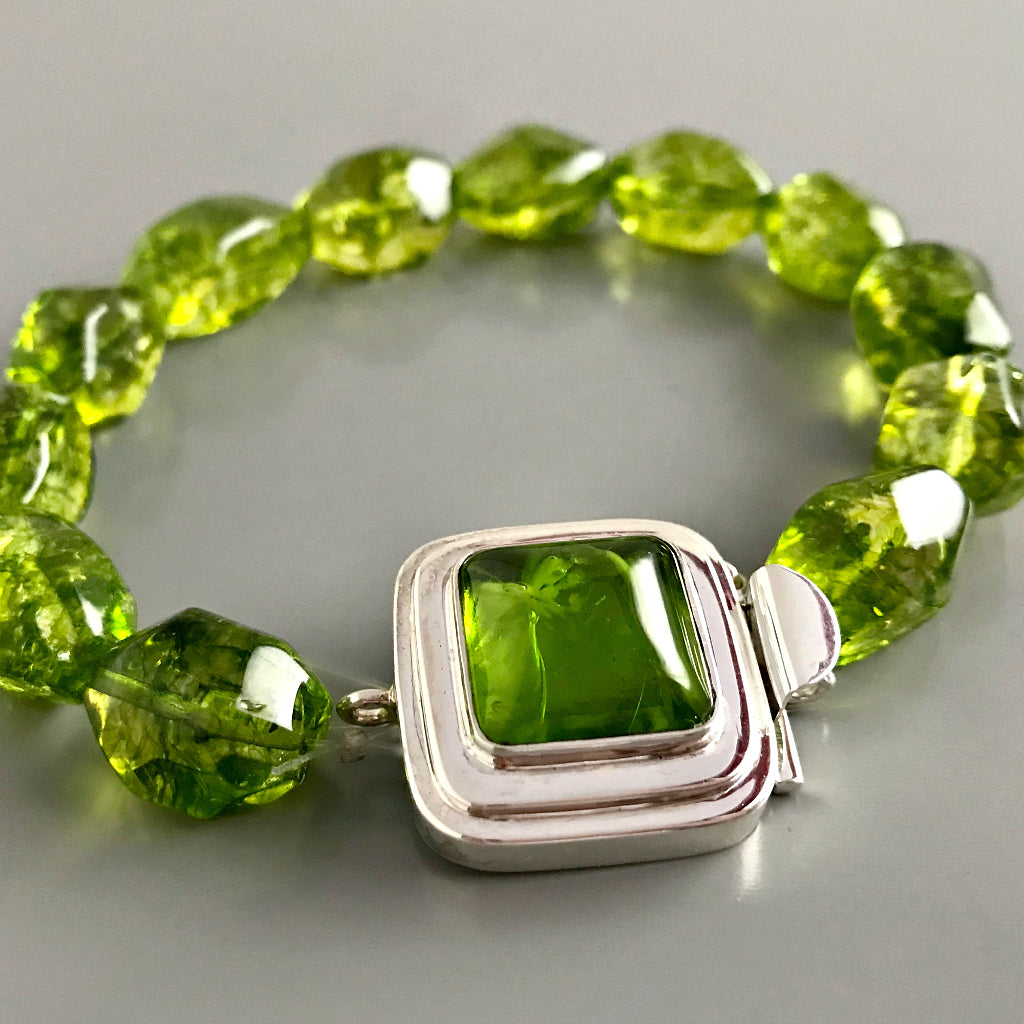 This Suzie Q Studio custom box clasp was handcrafted with a juicy, rich, lime-green vintage glass cabochon and set in a substantial amount (more than average) of sterling silver for a statement-making piece of jewelry. 