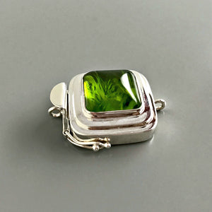 This Suzie Q Studio custom box clasp was handcrafted with a juicy, rich, lime-green vintage glass cabochon and set in a substantial amount (more than average) of sterling silver for a statement-making piece of jewelry. 