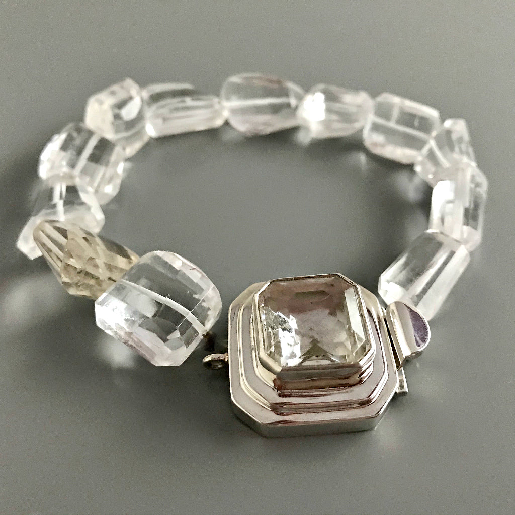 This Suzie Q Studio custom box clasp was handcrafted with a gorgeous, faceted glass cabochon, which is set in a substantial amount (more than average) of sterling silver. Its classic crystal color means that it’ll turn almost any jewelry design into a total “head-turner”!