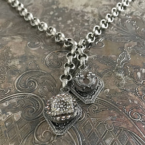 One-of-a-kind MY MOTHERS BUTTONS jewelry is handcrafted using thefinest antique buttons. The detailing of the buttons in this necklace isexceptional, especially the cornucopia motif!