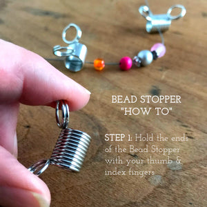 Suzie Q Studio's “must have” bead stringing invention, the Bead Stopper, prevents the beads on your bead stringing wire from slipping off the end while you create your design. They’re super-easy to use… Simply squeeze the rings to open the coils, slide in your bead stringing wire, release the rings.