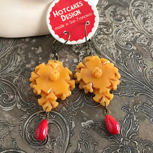 Suzie Q Studio carries HOTCAKES DESIGN retro-style, handmade jewelry taking its inspiration from classic Bakelite jewelry, vintage images and bold color. Resin is a fantastic material to use for jewelry-making, because you can make a bold statement on your ears, such as with these “Deco-Flavoured Delights", without it being too heavy.