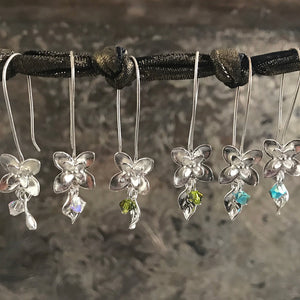 This Suzie Q Studio earring collection features handmade earrings created by Suzie Q Studio artisans. If you love a more delicate, modern-natural look, these precious, handcrafted sterling silver flower earrings, with a hint of Swarovski sparkle, are perfect for you and they're available in a variety of gorgeous colors.