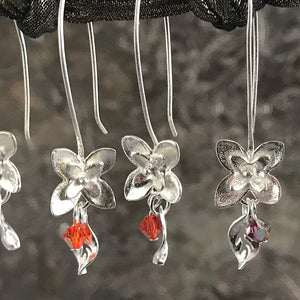 This Suzie Q Studio earring collection features handmade earrings created by Suzie Q Studio artisans. If you love a more delicate, modern-natural look, these precious, handcrafted sterling silver flower earrings, with a hint of Swarovski sparkle, are perfect for you and they're available in a variety of gorgeous colors.